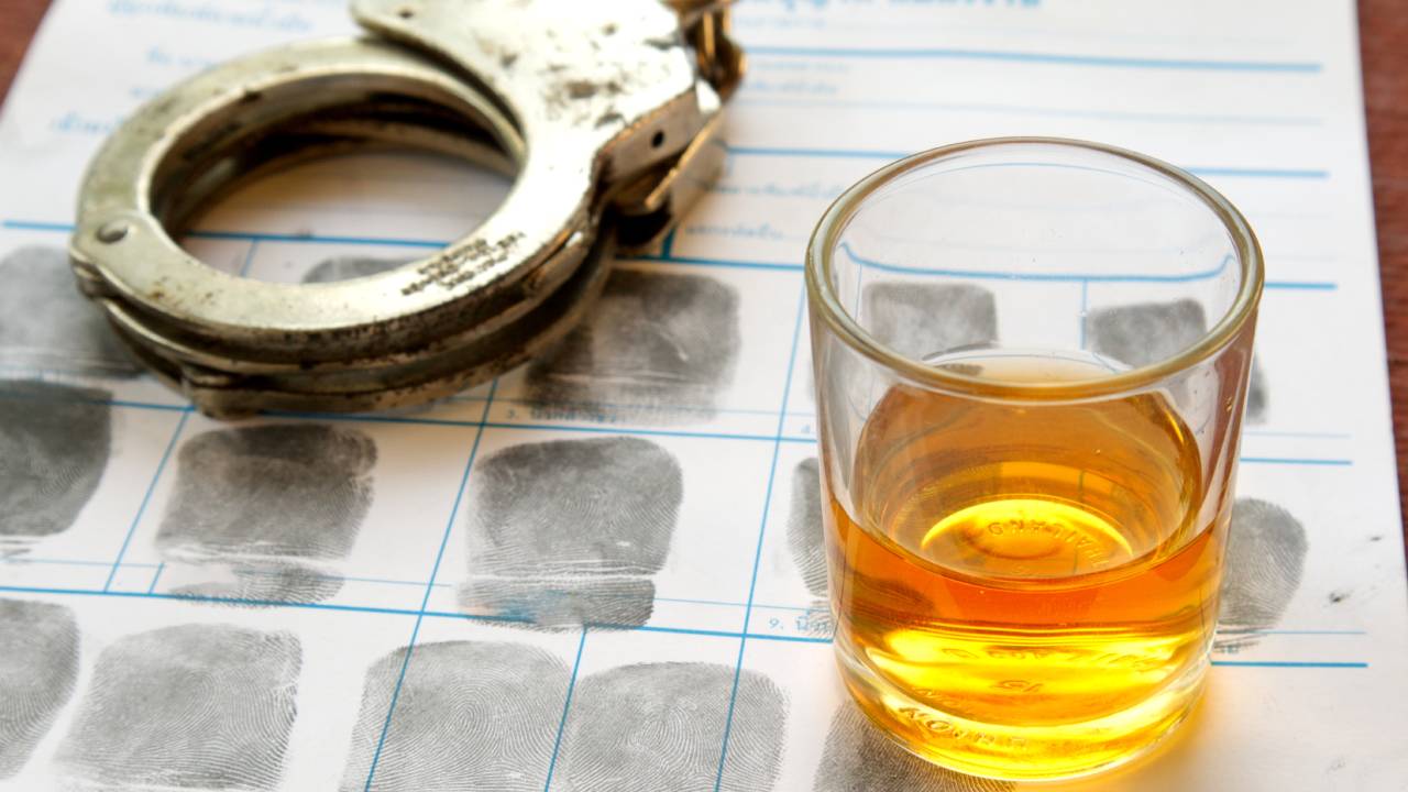alcohol beside a handcuff