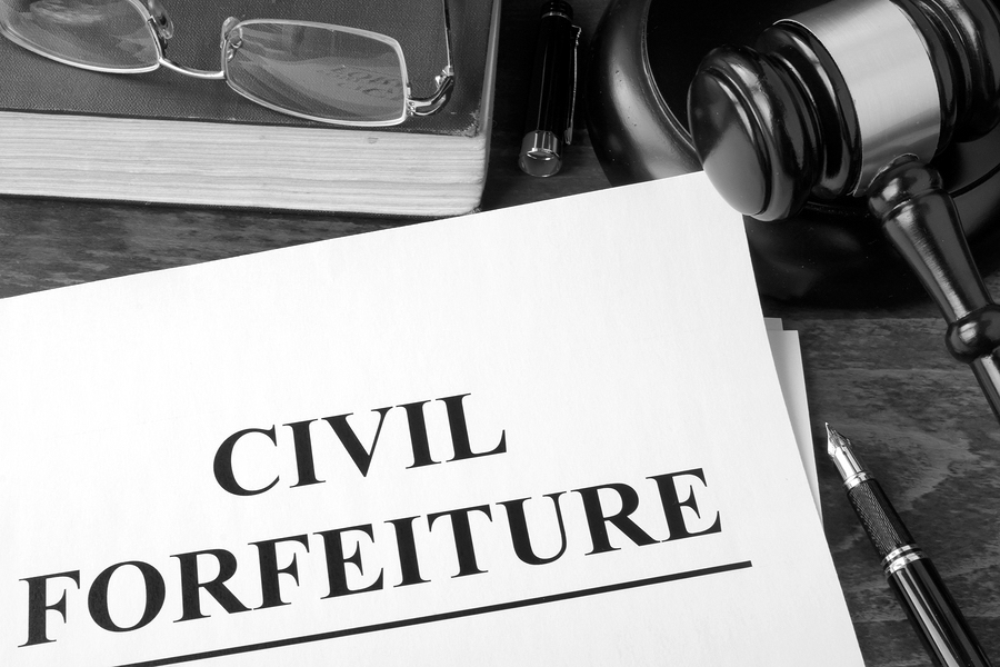 Civil forfeiture, documents and gavel on a table.