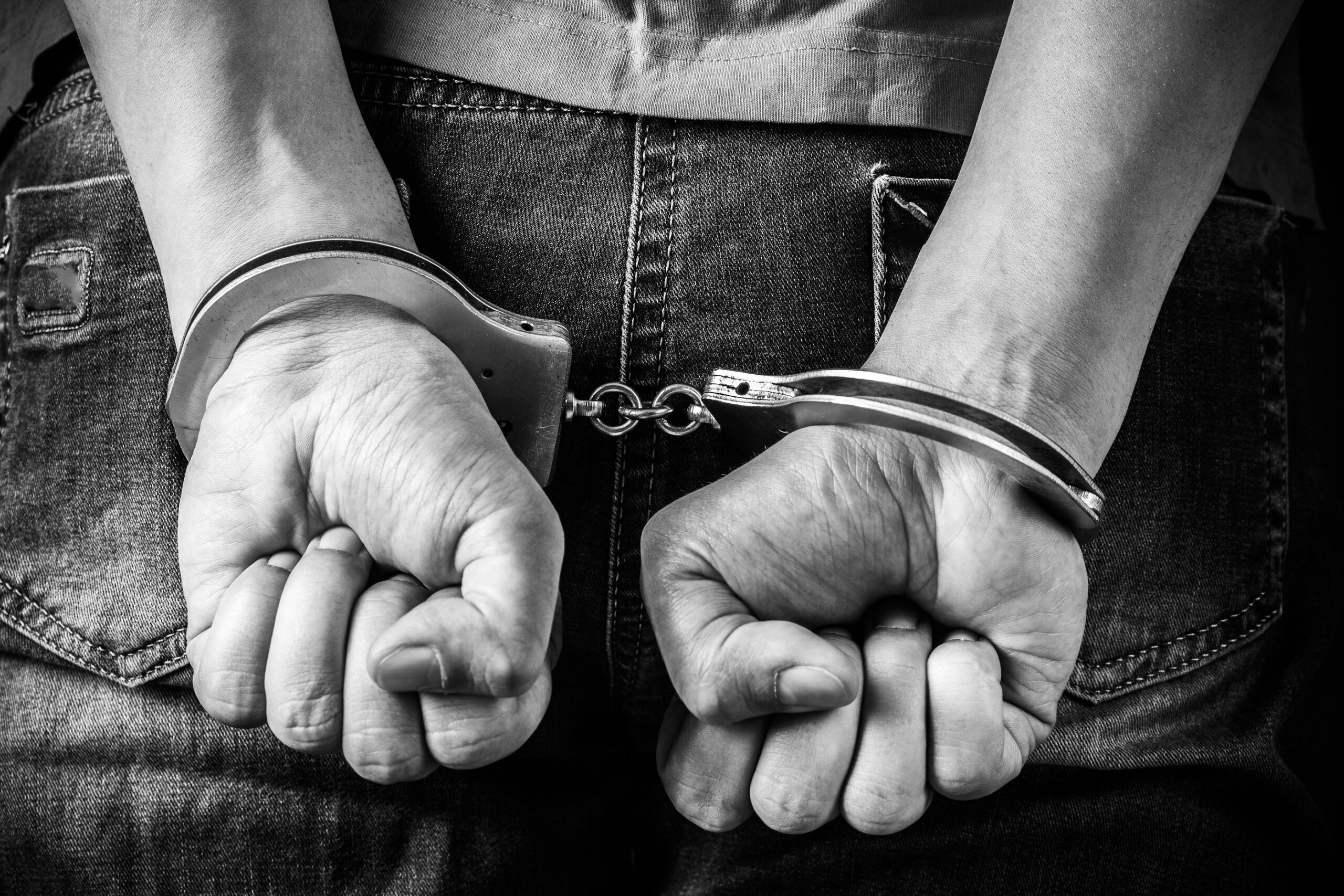 Man Hands In Handcuffs
