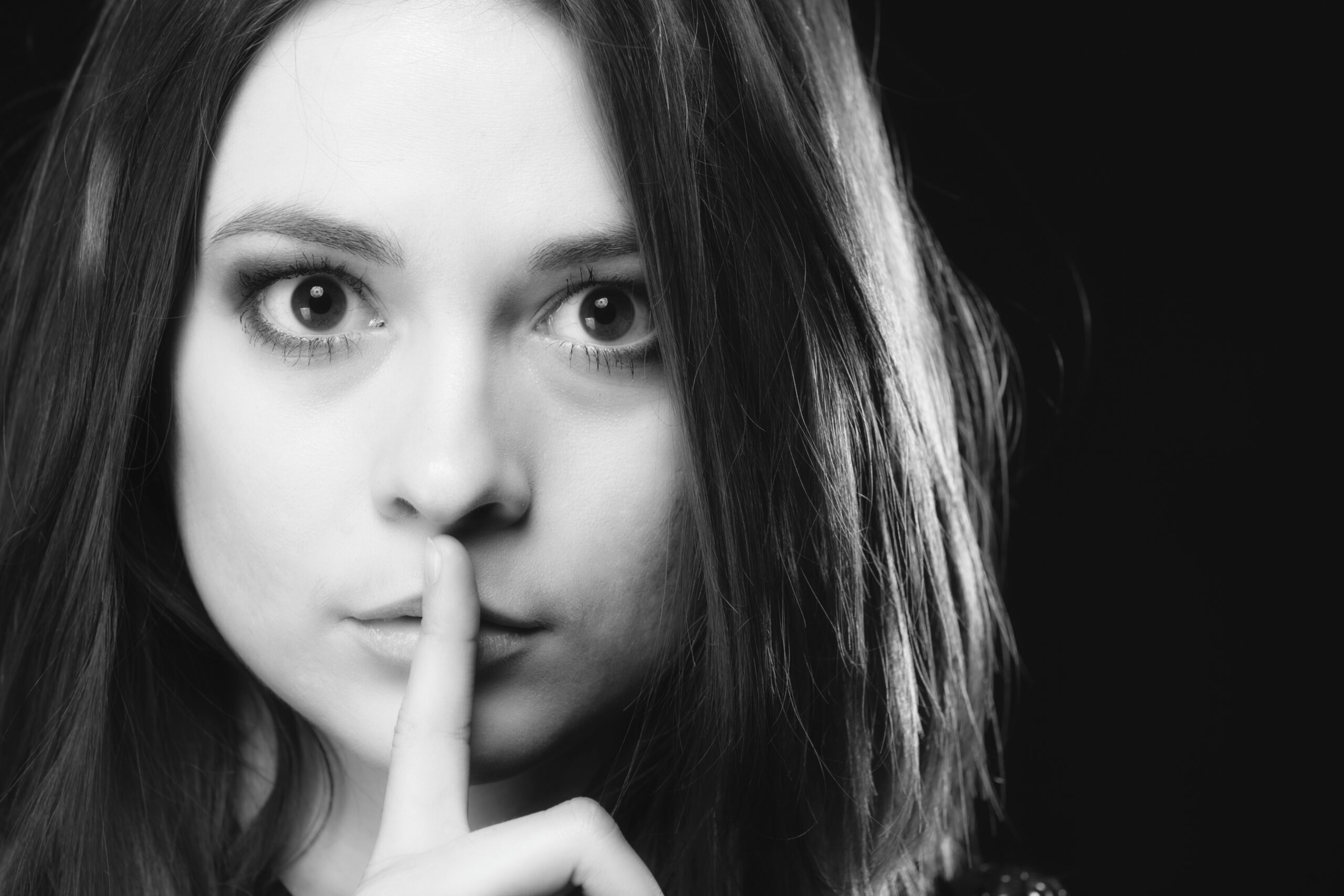Secret Woman. Girl Showing Hand Silence Sign