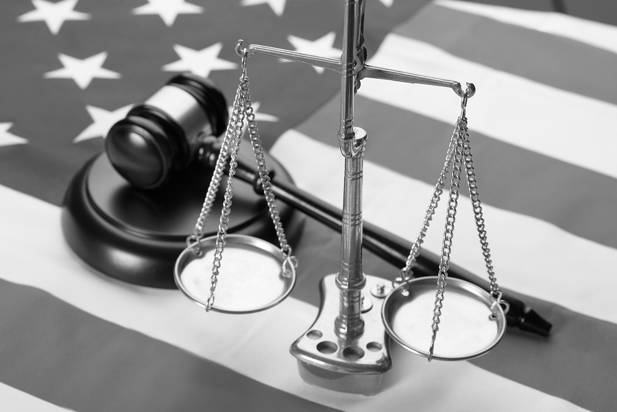 Justice Scale And Wooden Brown Gavel On Usa Flag